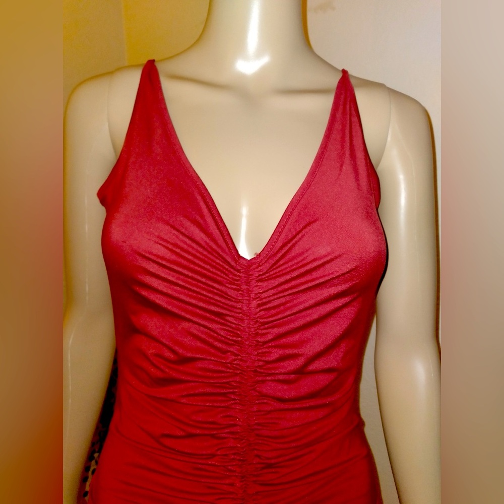 🧨 mini dress with straps and rippling detail down front. Ties at bottom.